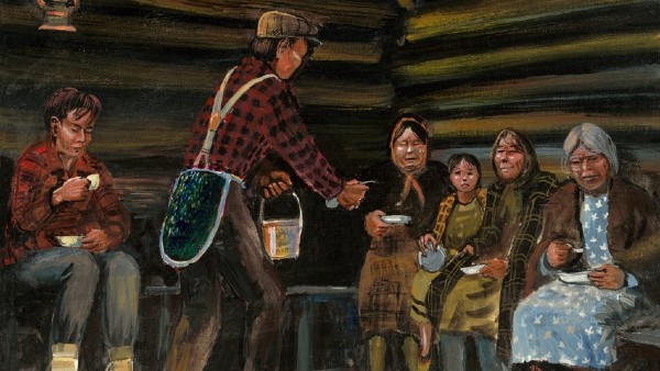 Joe Pete dancing in the roundhouse with his green bag, holding a pot of soup in his left hand to serve a group of women