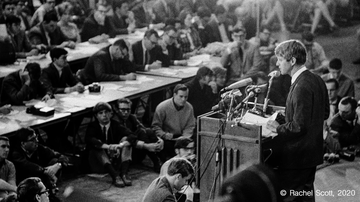 Black and white photograph of Robert F Kennedy speaking in front of a crowd of students