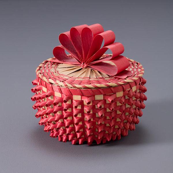 intricate woven basket in red and natural color